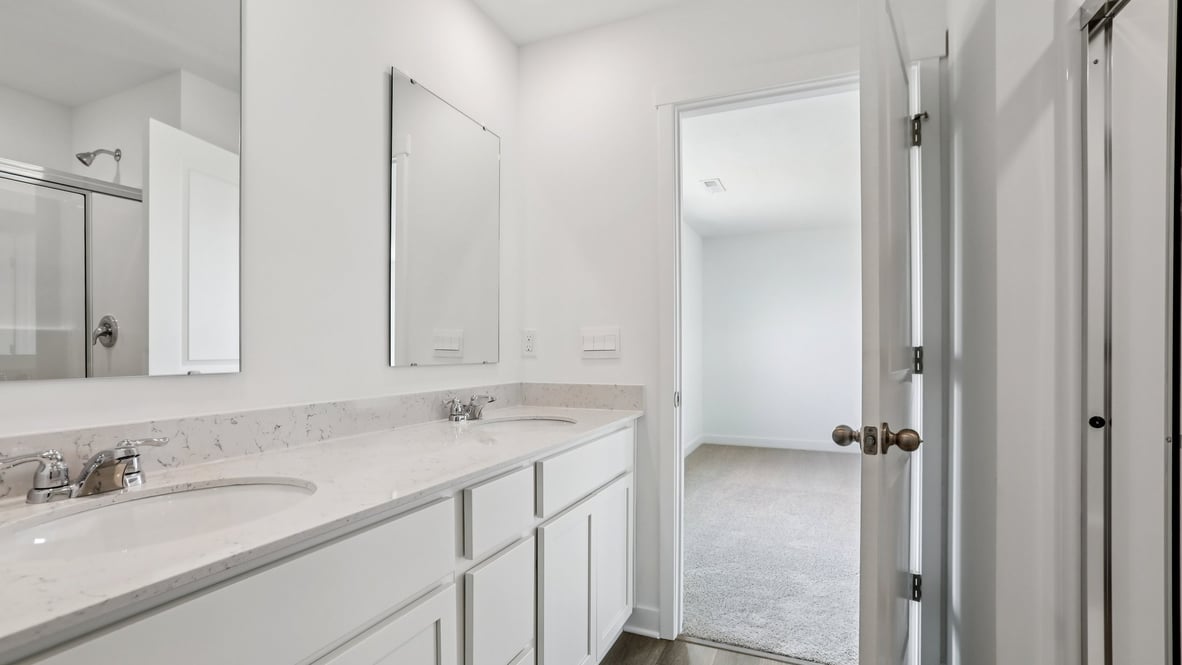 primary bathroom with dual vanity