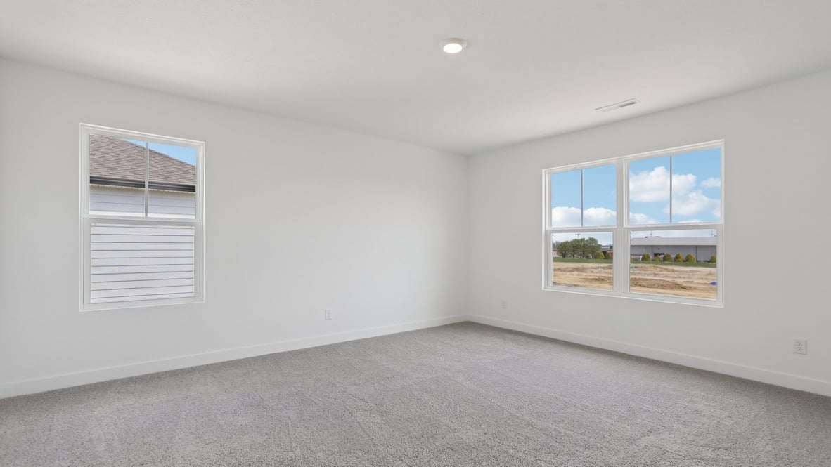 primary bedroom with large windows