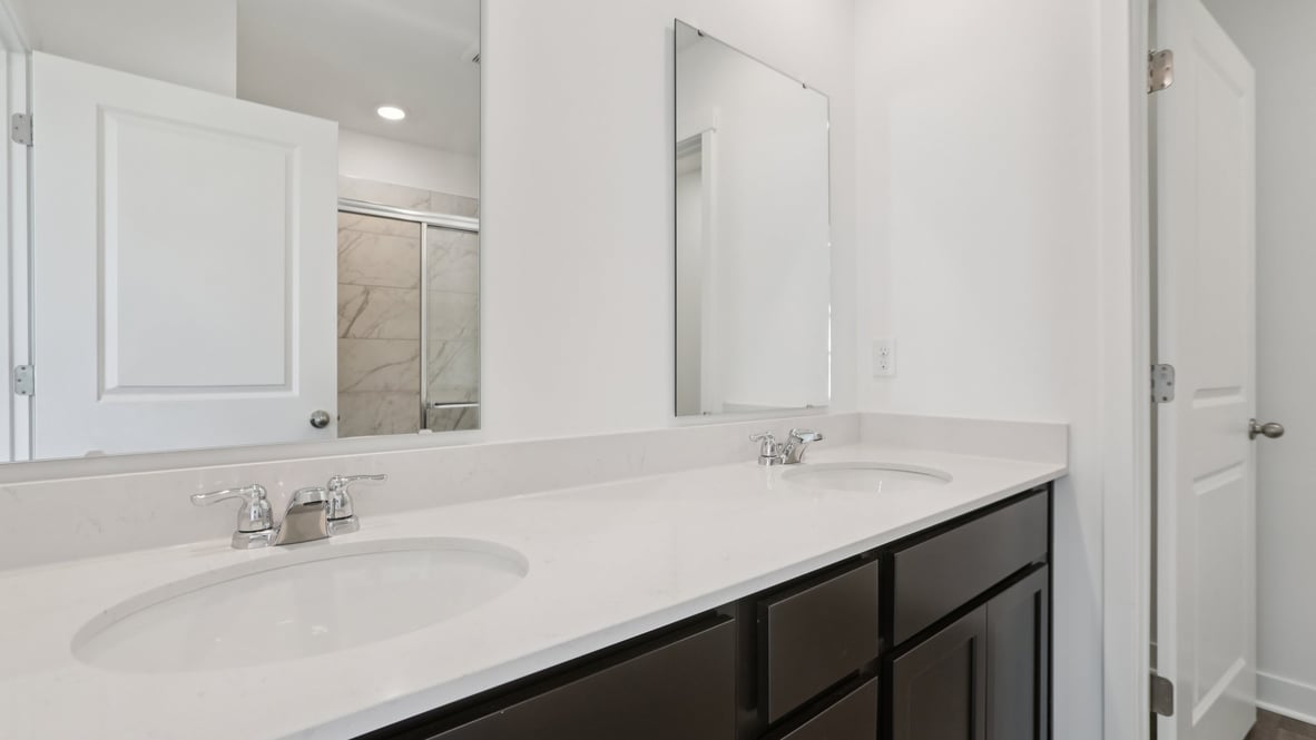 primary bathroom with dual vanity