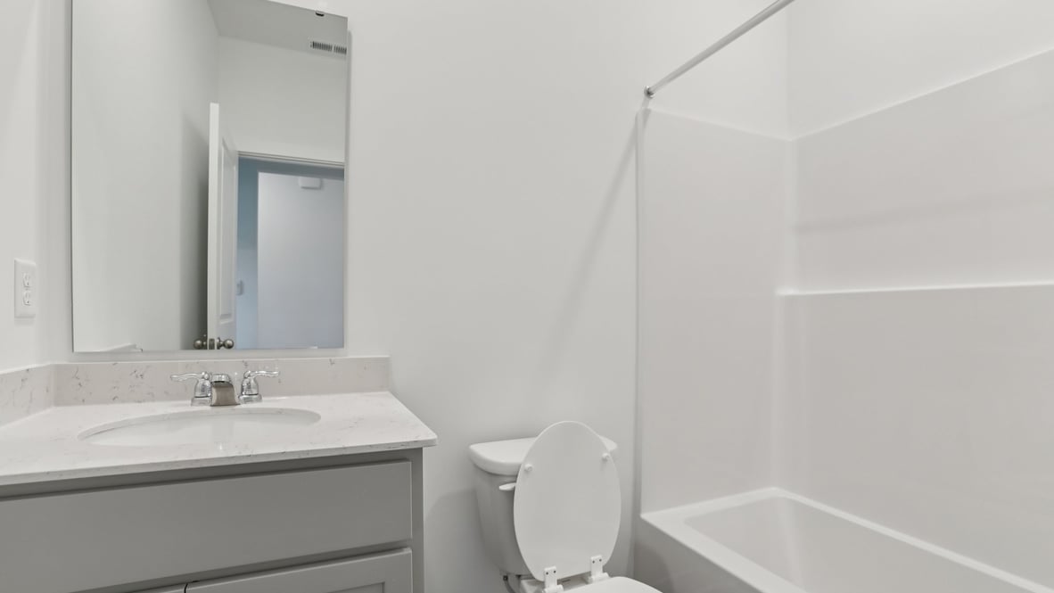 bathroom with shower and tub combo