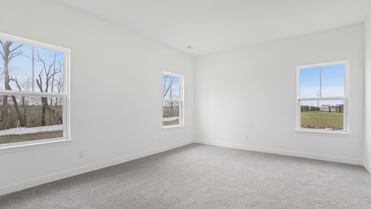 primary bedroom with large windows