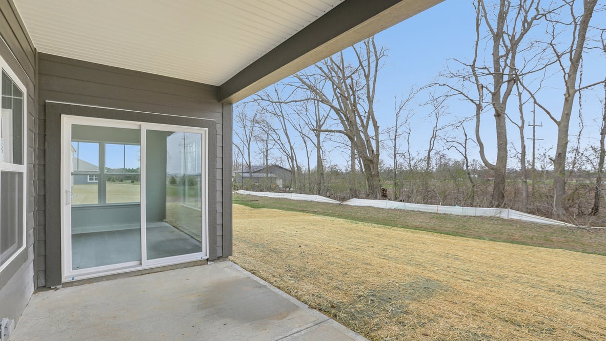 covered patio on the back of the home