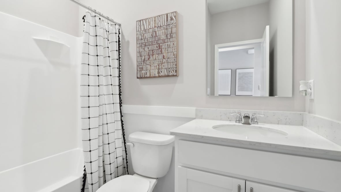 bathroom with shower and tub