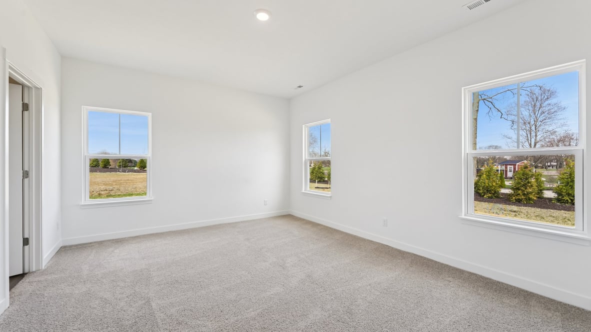 primary bedroom with large windows