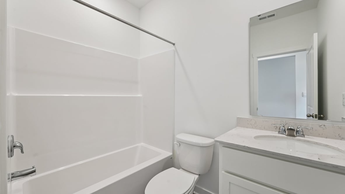 bathroom with shower and tub