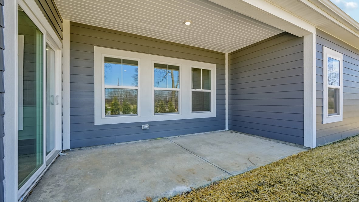 covered patio on the back of the home