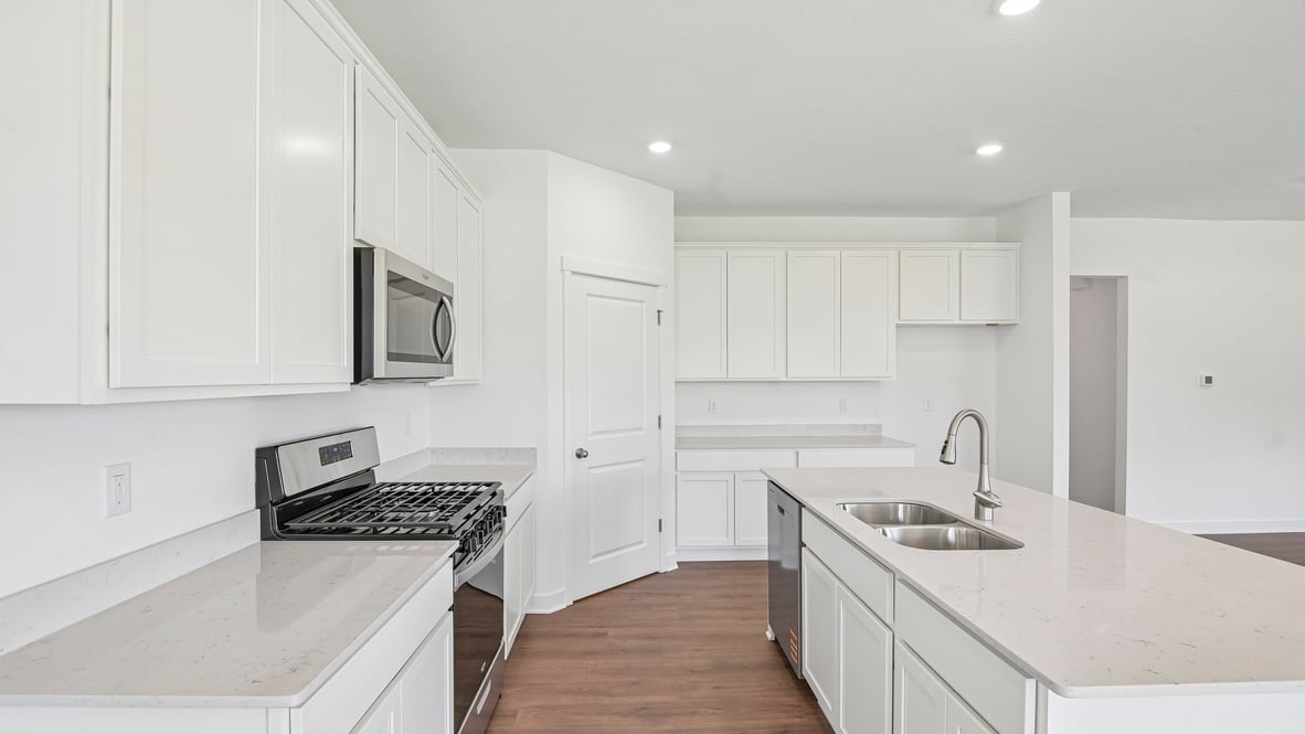 kitchen with large corner pantry