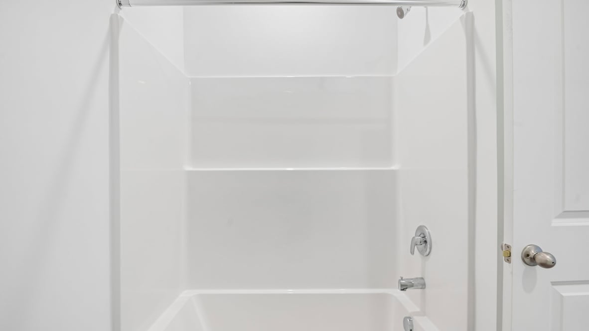 bathroom with shower and tub combo