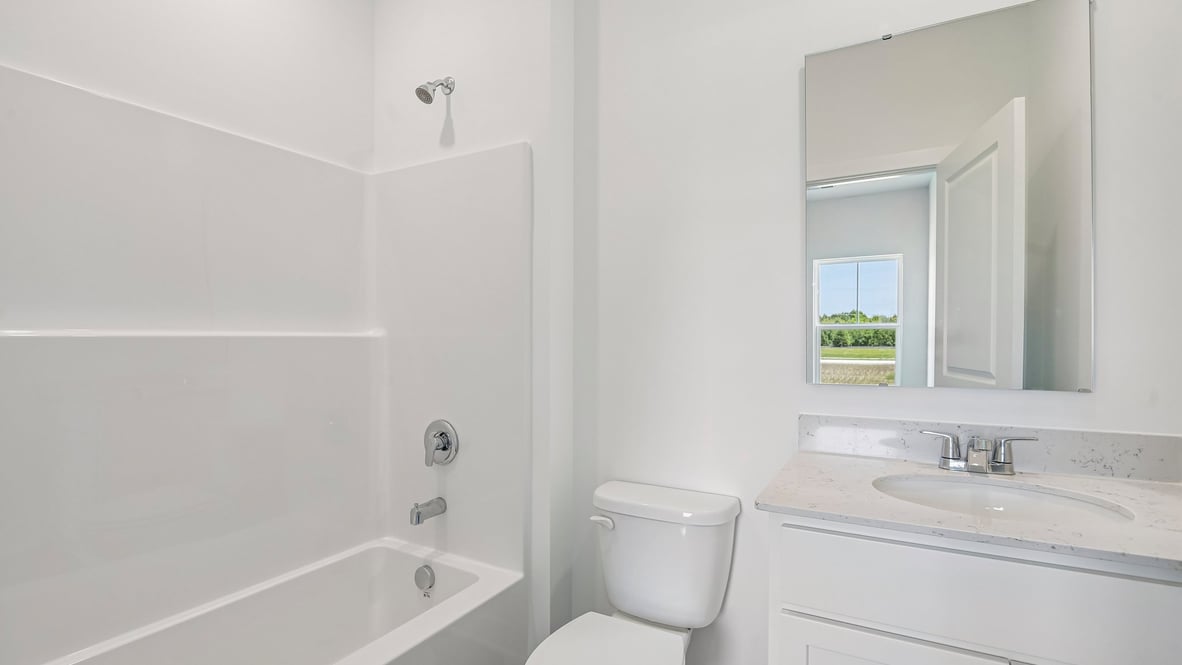 bathroom with shower and tub