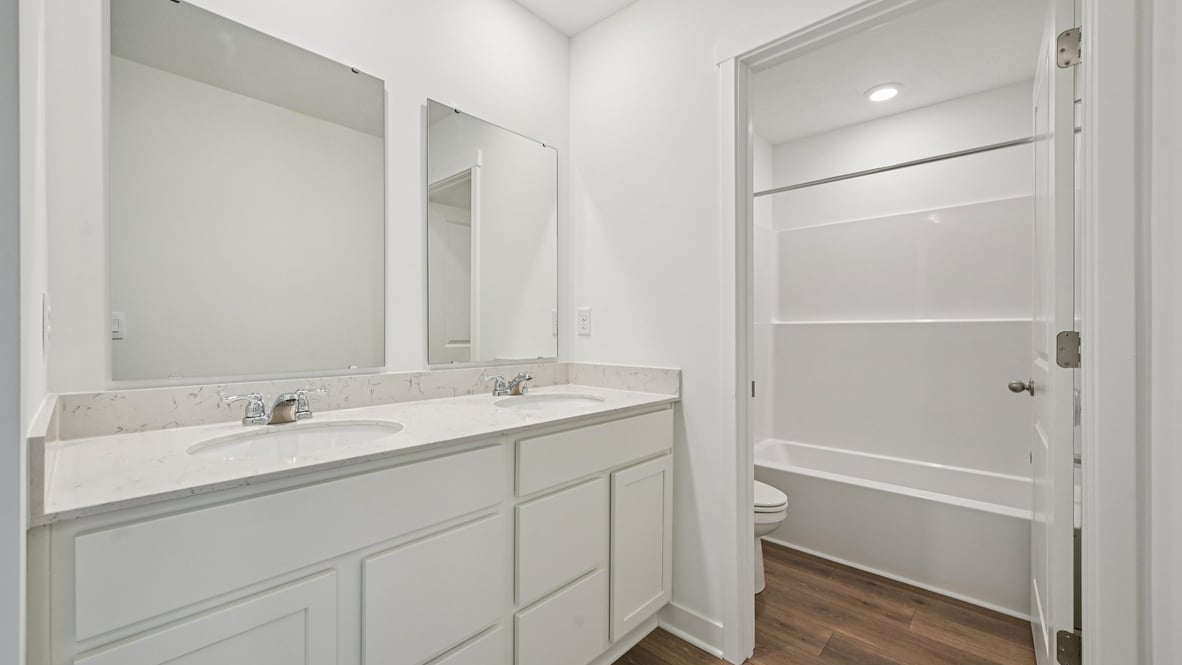 bathroom with dual vanity