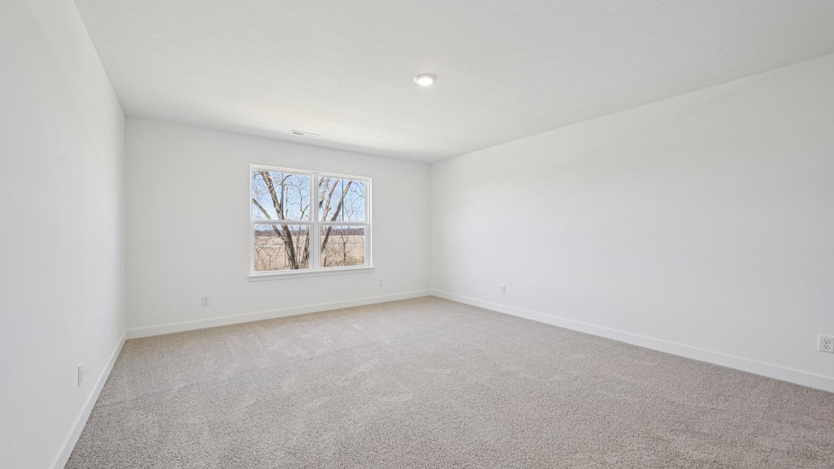 primary bedroom with large windows