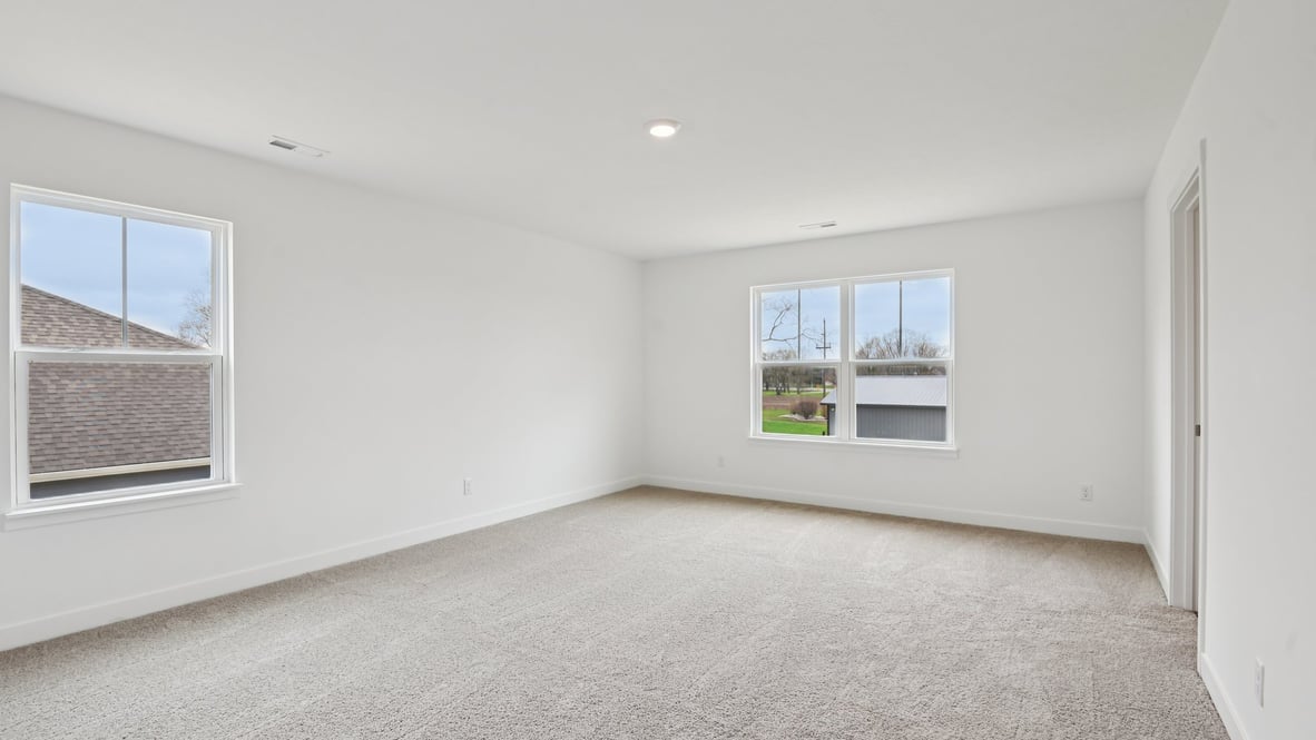 primary bedroom with large windows