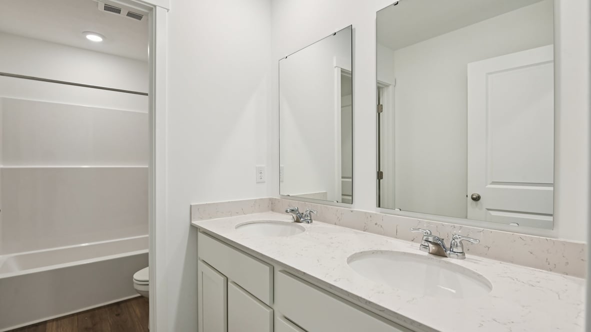 bathroom with dual vanity