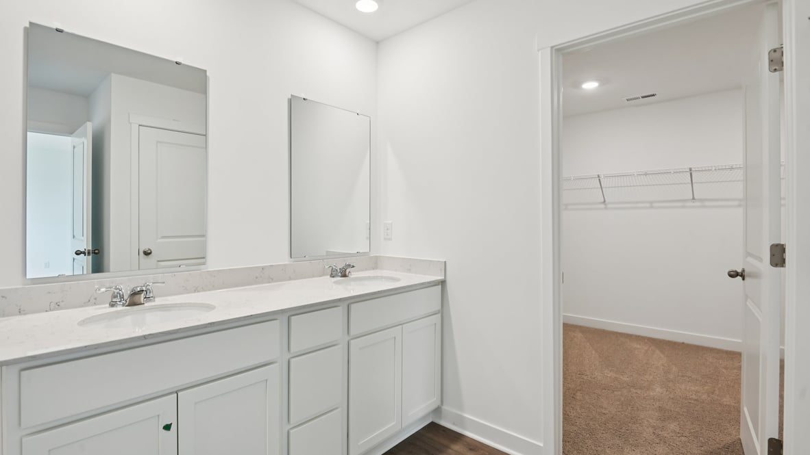 primary bathroom with walk-in closet