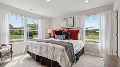 primary bedroom with large windows