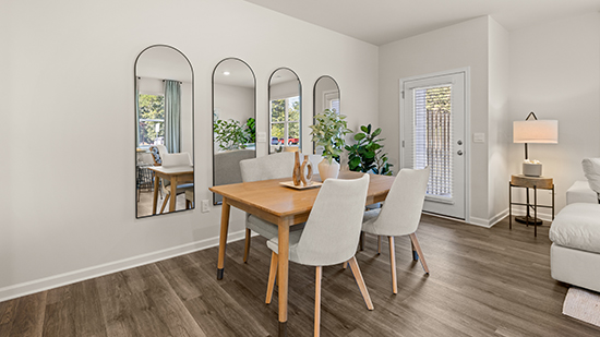 open concept townhome layout with bar seating and living and dining space