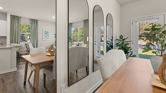 open concept townhome layout with bar seating and living and dining space