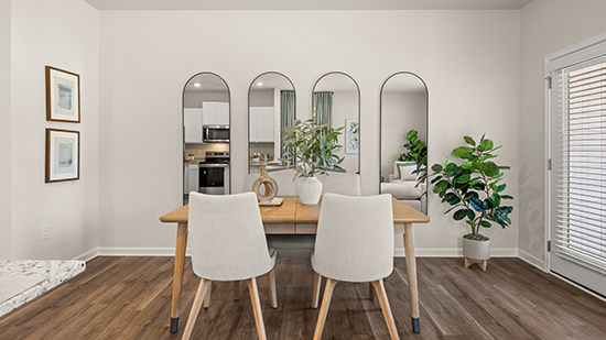 open concept townhome layout with bar seating and living and dining space