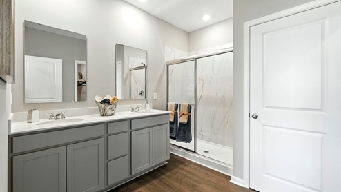 primary bathroom with dual vanity