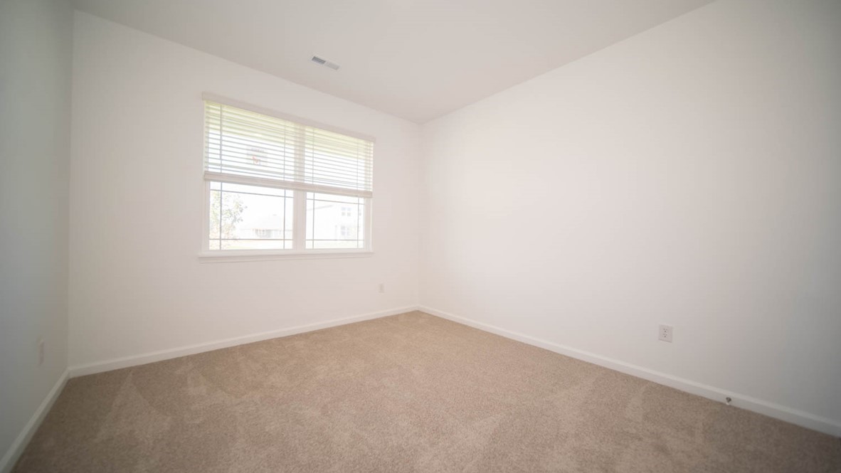 bedroom 2 with large windows