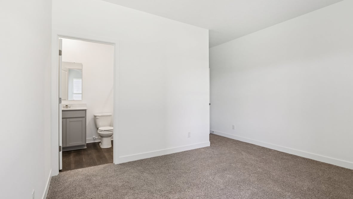 large fourth bedroom with en suite bathroom