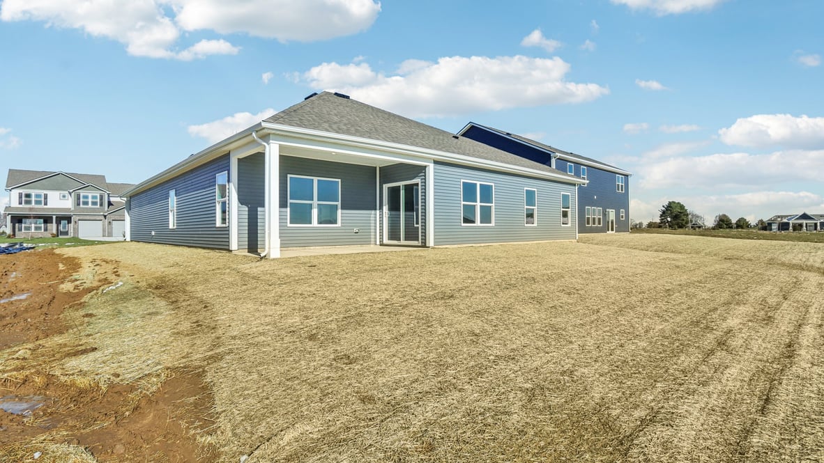 large back yard with covered porch