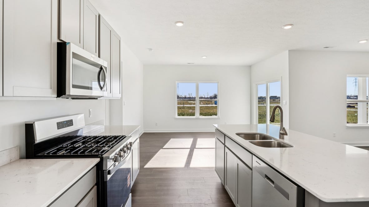 beautiful kitchen with natural light and whirlpool stainless steel appliances