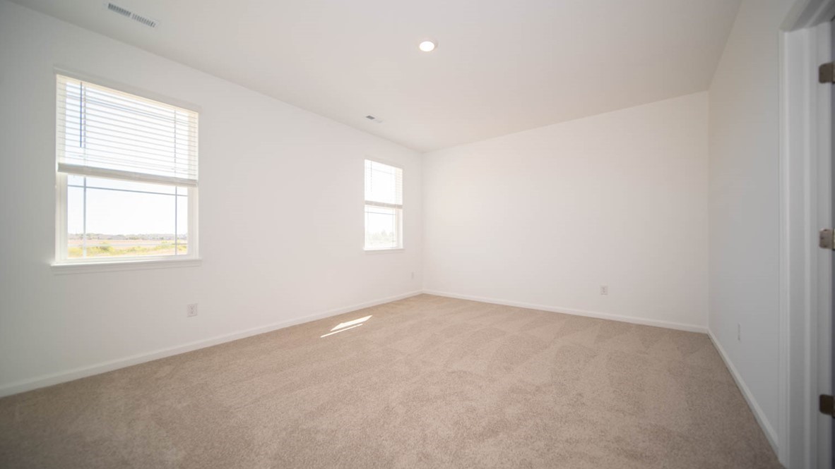 primary bedroom with large windows