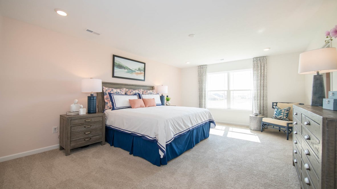 primary bedroom with large windows