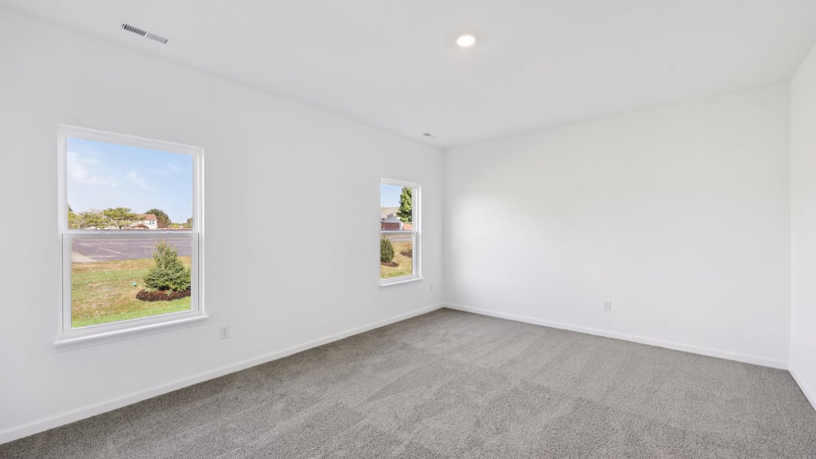 primary bedroom with large windows