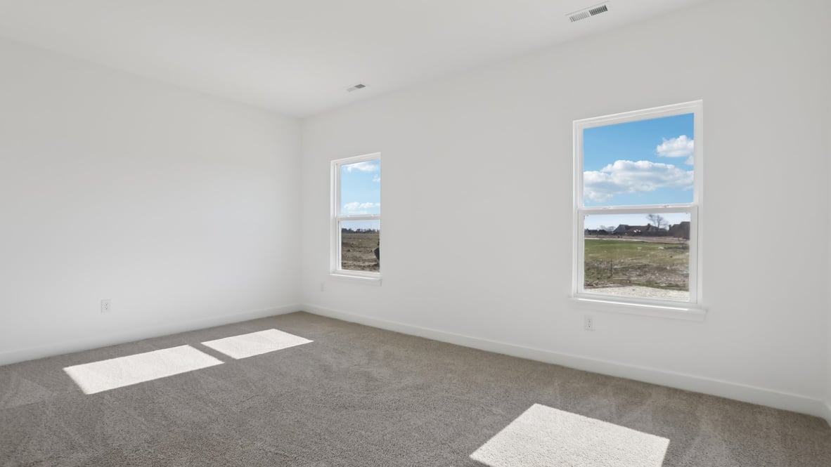 primary bedroom with large windows