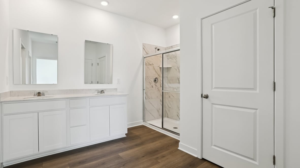 primary bathroom with dual vanity