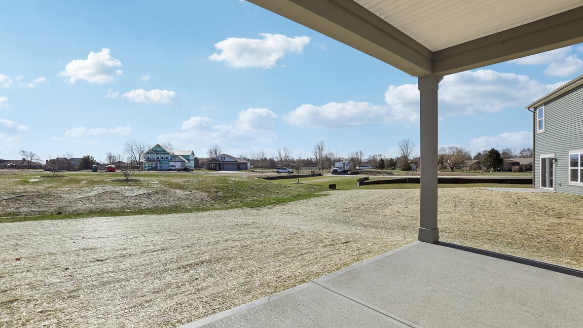 covered patio on the back of the home