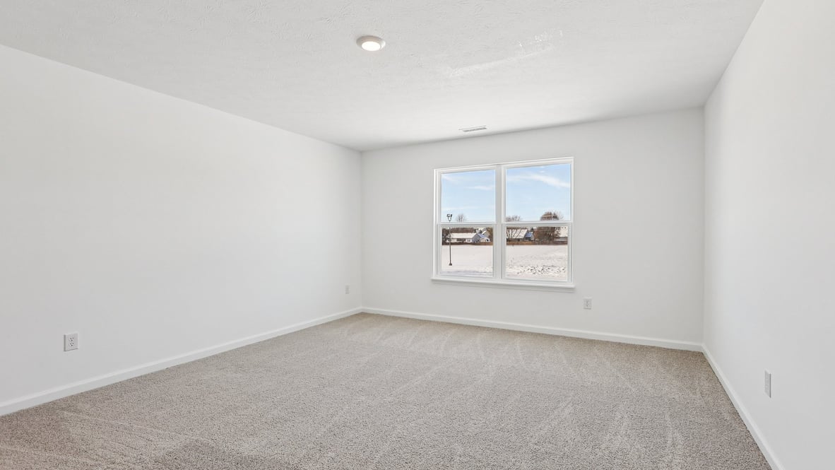 primary bedroom with large windows