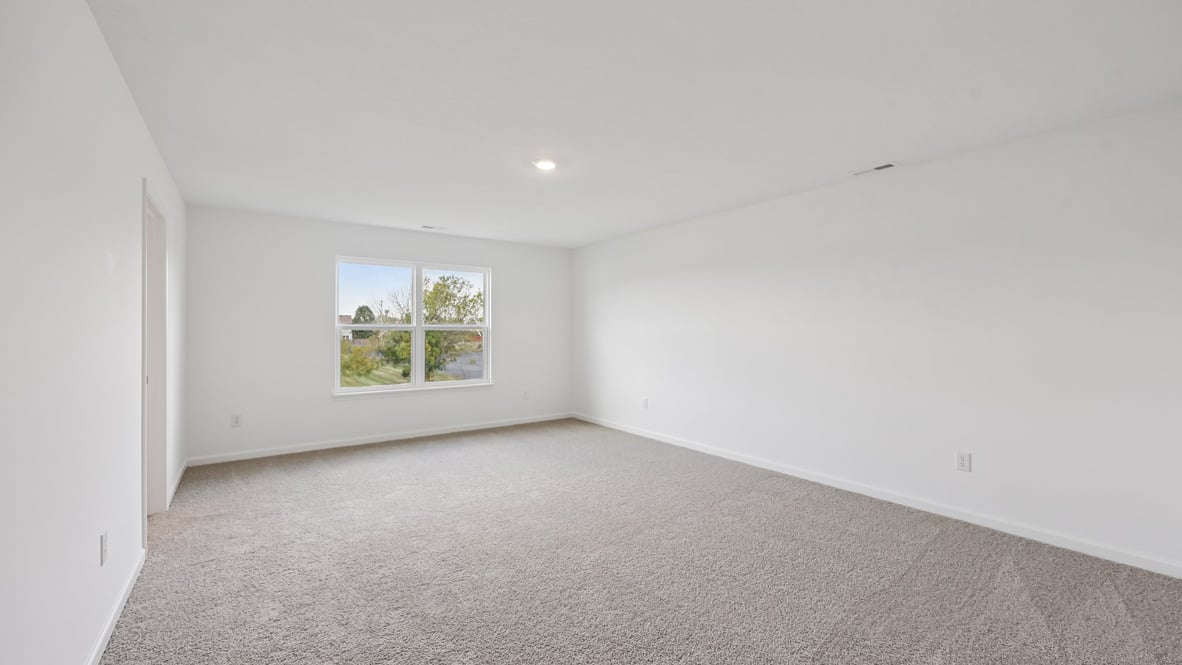 primary bedroom with large windows