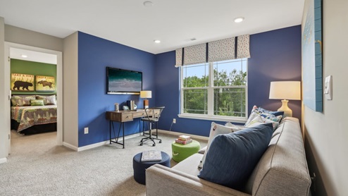 upstairs loft with blue accent wall