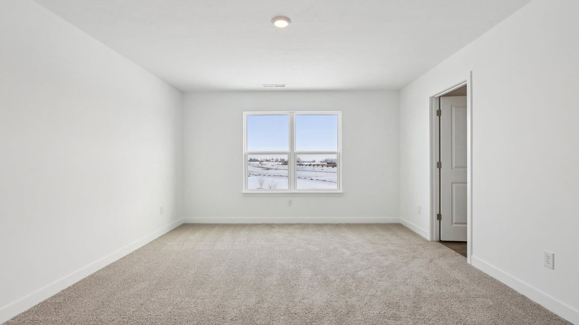 primary bedroom with large windows