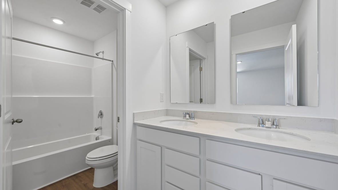 bathroom with dual vanity