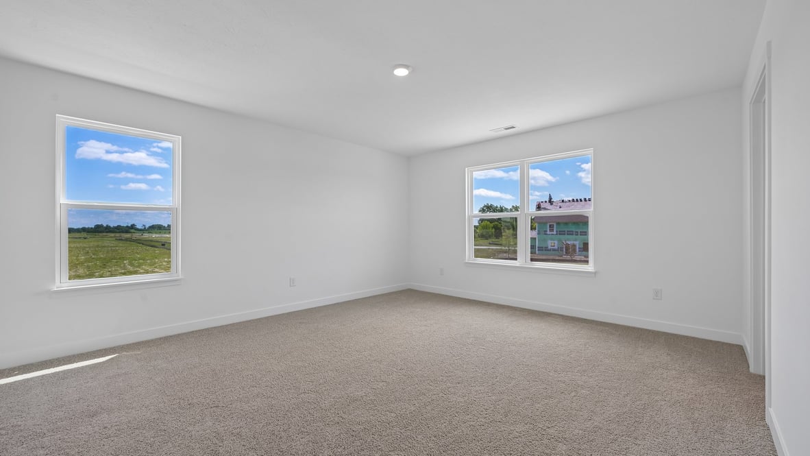 primary bedroom with large windows