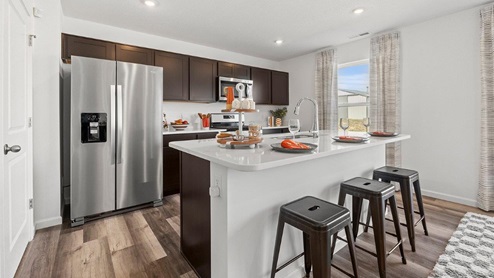 Colonial Heights Bellamy model home kitchen with large island with room for seating
