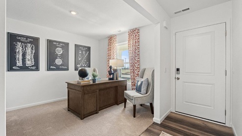Colonial Heights Bellamy model home flex room decorated as office on the first floor