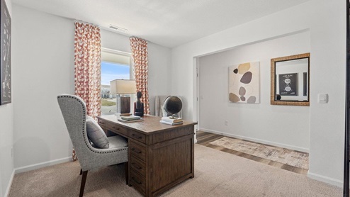 Colonial Heights Bellamy model home flex room with carpet flooring and single window