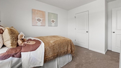 Colonial Heights Bellamy model home bedroom 3 with carpet flooring and closet