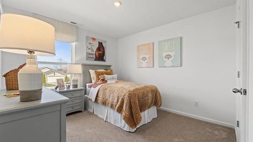 Colonial Heights Bellamy model home bedroom 3 with window