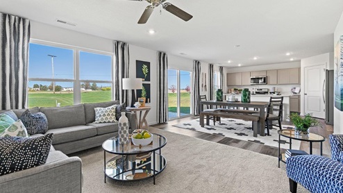 Livingston Lakes Holcombe model home living room with carpet flooring