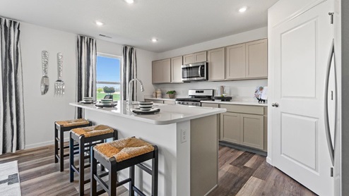 Livingston Lakes Holcombe model home kitchen with large island with room for seating
