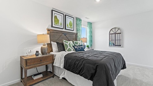 Livingston Lakes Holcombe model home bedroom 4 with single window and carpet