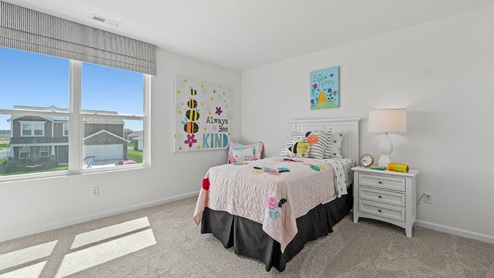 Livingston Lakes Holcombe model home bedroom 3 with 2 windows and carpet flooring