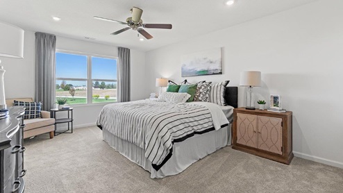 Livingston Lakes Holcombe model home main bedroom with large double windows