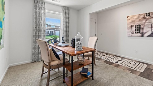 Livingston Lakes Holcombe model home flex room decorated as an office space near the front door